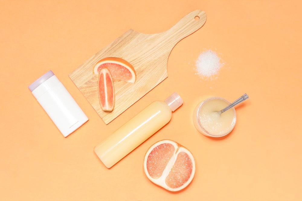 IYOBA promo image orange background with citrus fruits and wooden board